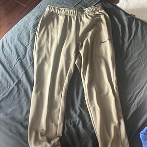 green nike tracksuit bottoms